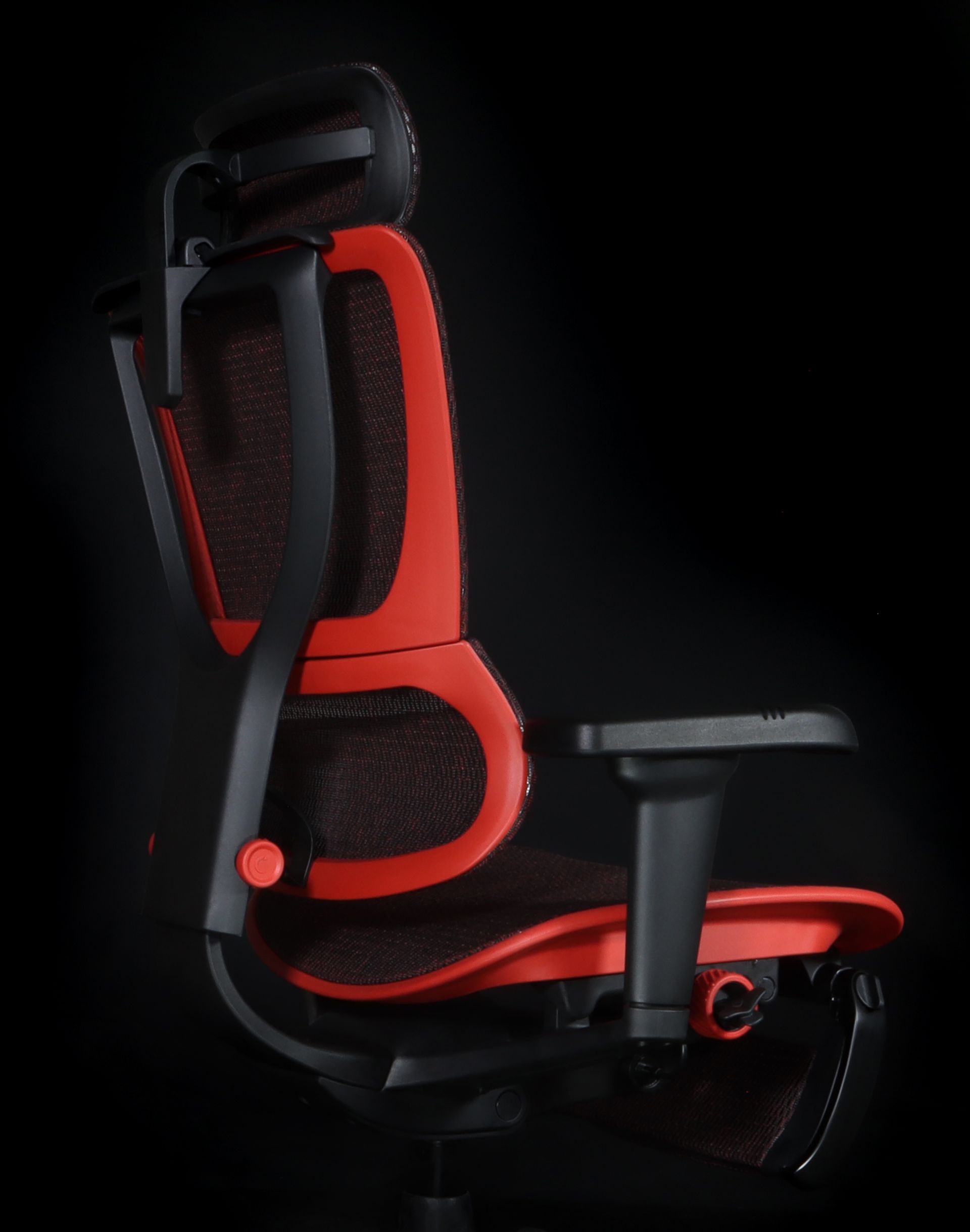 Back view of the Mirus Ultra gaming chair, showcasing the red frame and black mesh.