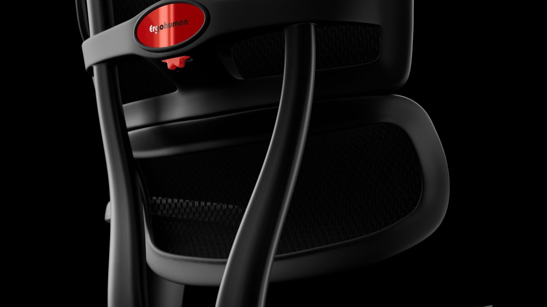 close up of the back of the black ergohuman ultra featuring the split back and lumbar support. you can see the red ergohuman logo on the back of the chair