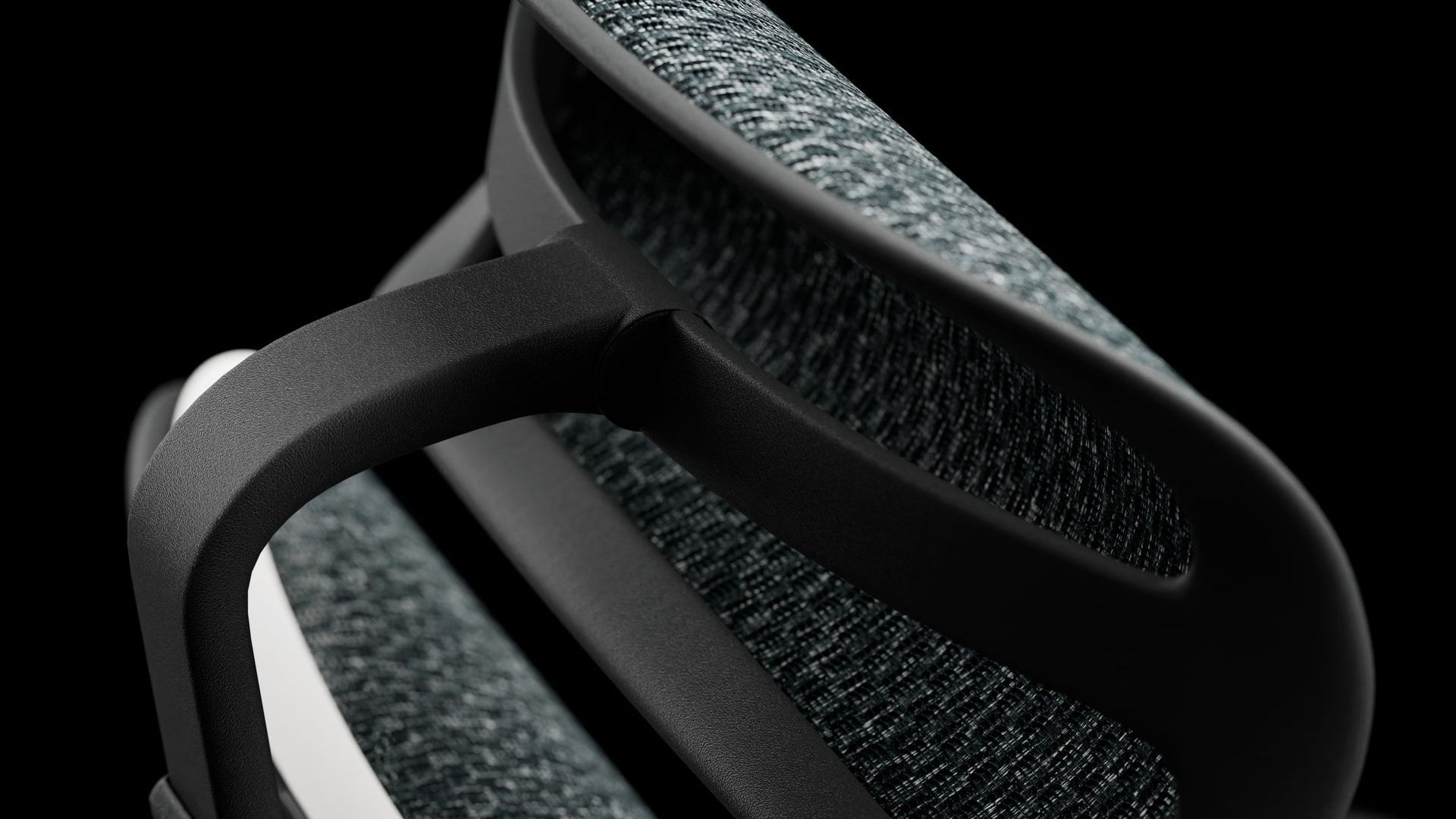 close up of the black ergohuman ultra headrest with mesh upholstery; the headrest is angle- and pivot-adjustable