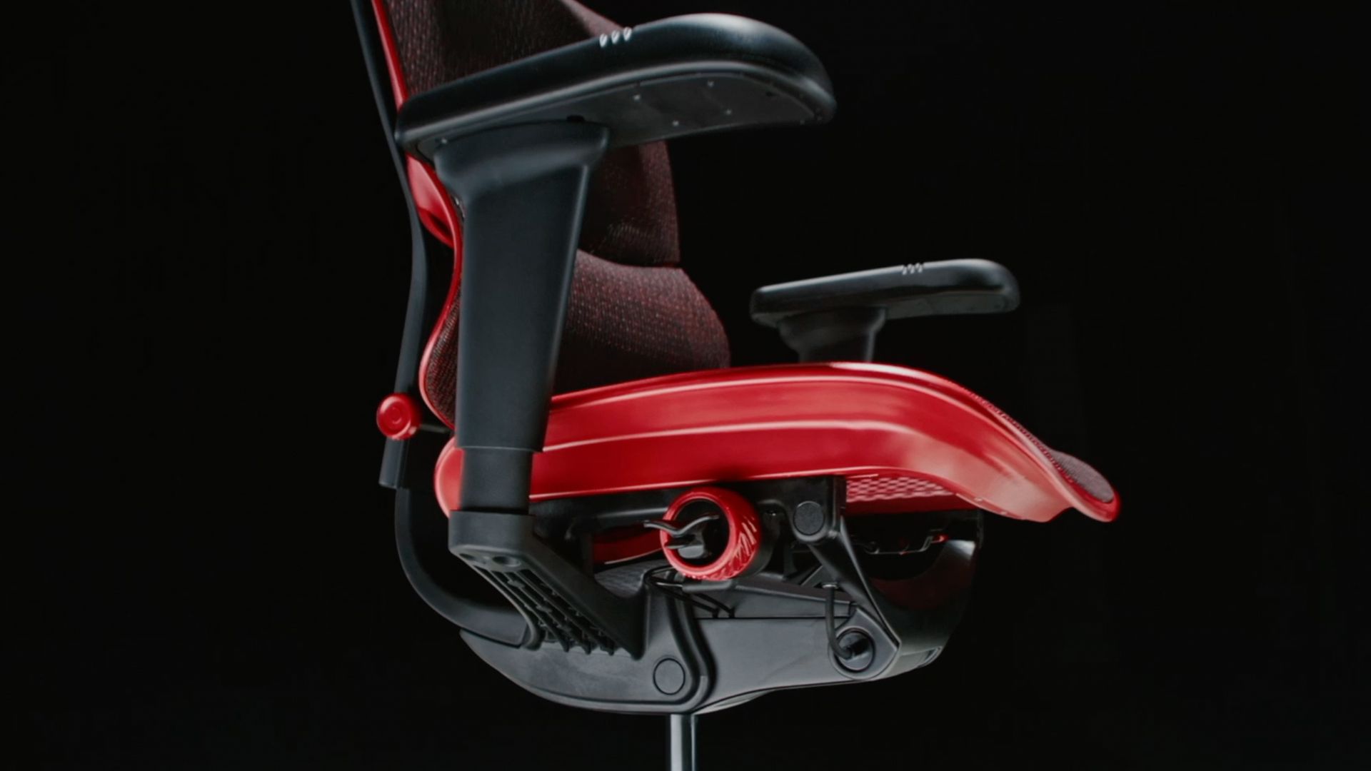 Profile view of the red ergohuman ultra gaming chair