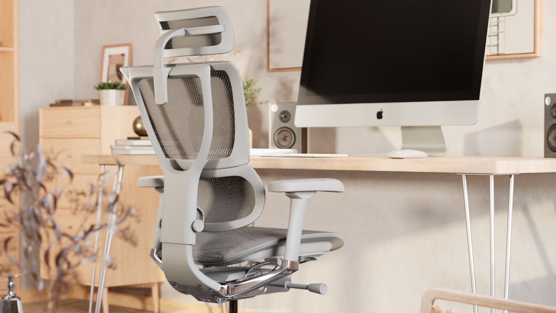 Grey Mirus Elite G2 - ergonomic office chair - situated at a light wood desk with an iMac, speakers and plants in a home office