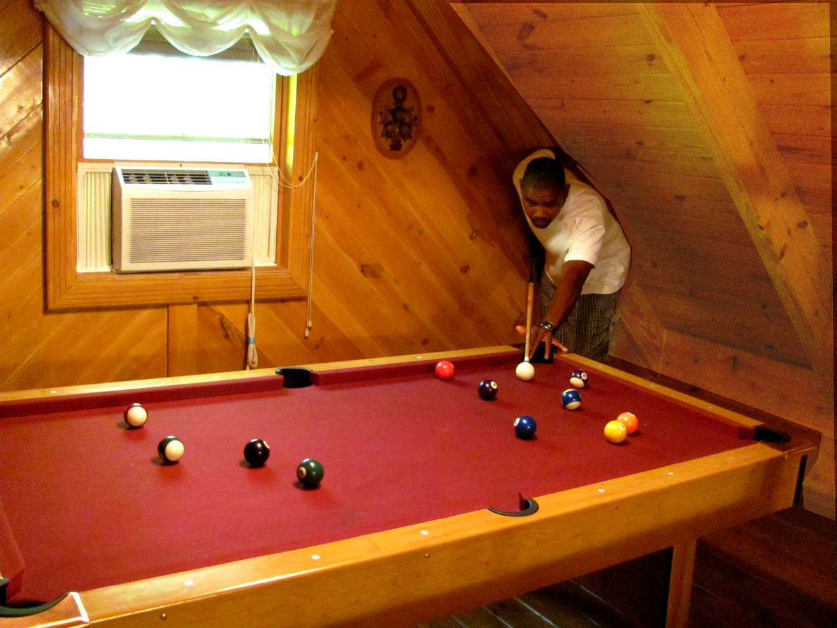man playing pool