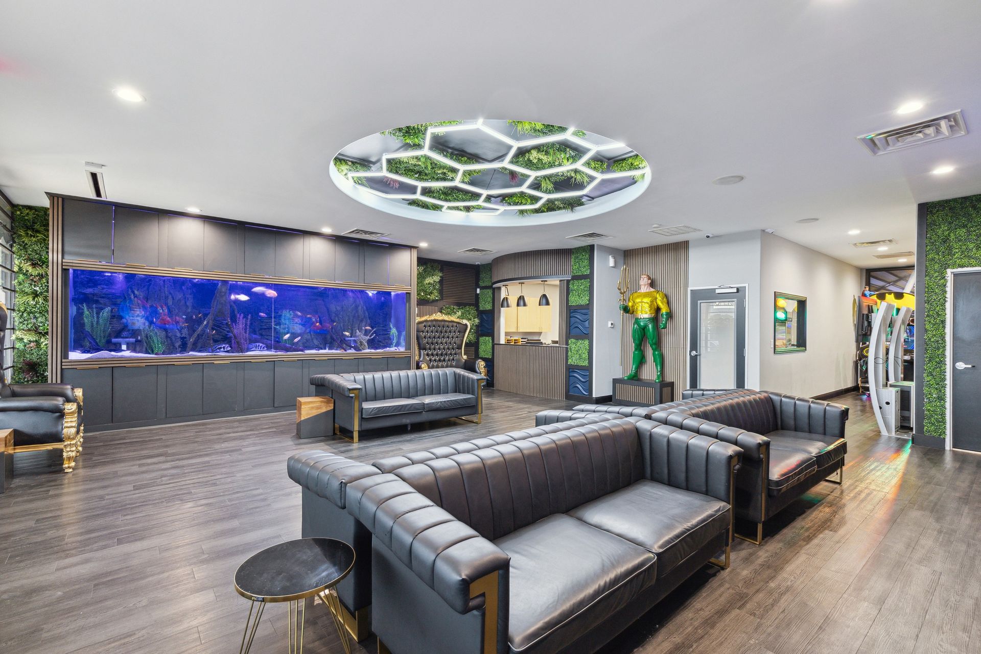 Aqua Dental and Orthodontics in Duncanville, TX. A waiting room with a couch , chairs and a large fish tank.