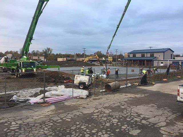 A group of construction workers are working on a construction site.