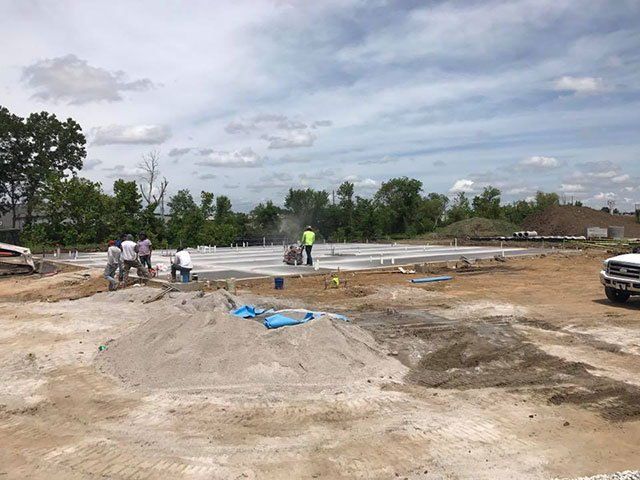 A group of people are working on a construction site.
