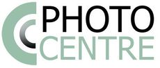 the logo for the photo centre is green and black .
