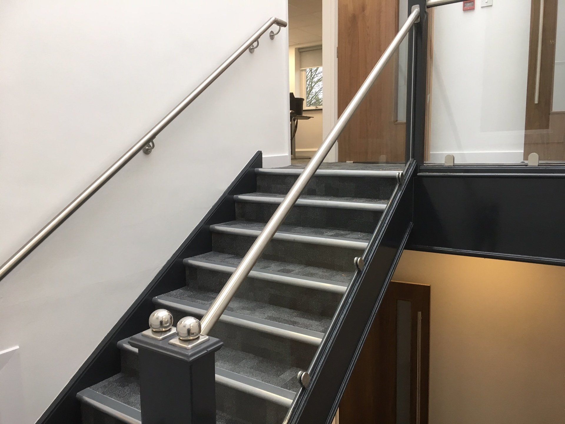 Glass inserts and stainless top rail. To enhance a standard staircase