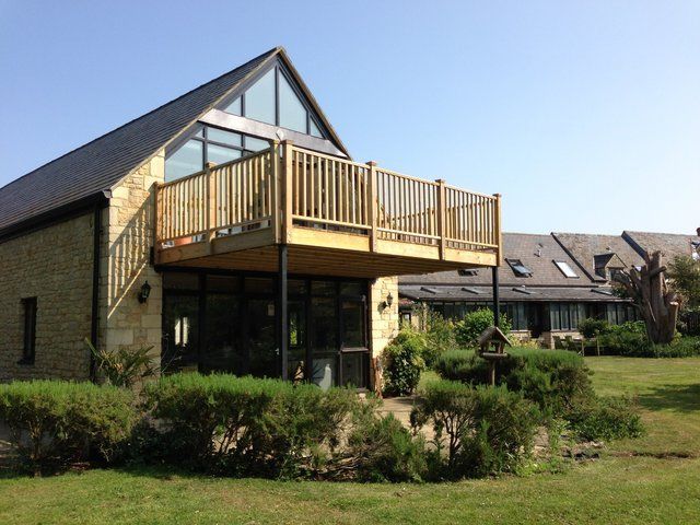 Structural support and deck for large balcony