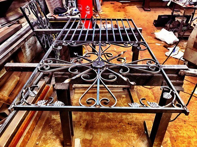 Ornate gate during fabrication