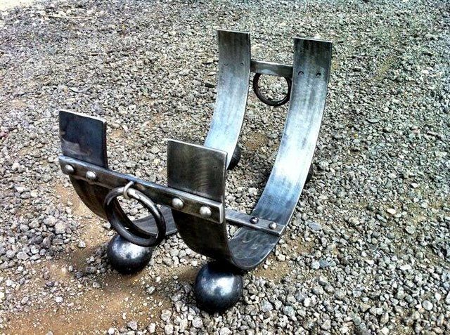 Ornate log holder for hearth