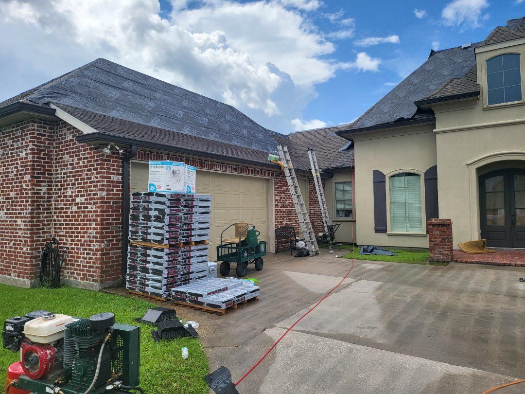 A large house with a roof that is being installed.