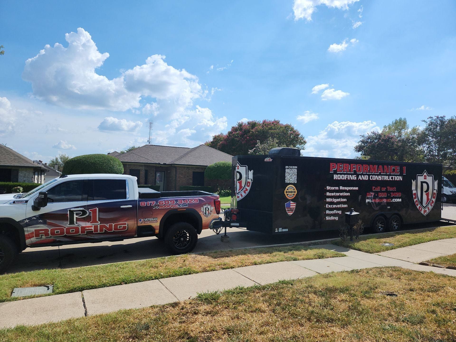 White truck with trailer, both branded with 