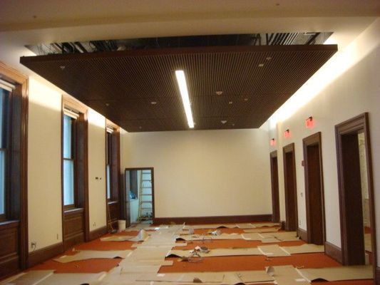 An empty room with a ceiling that has a light on it