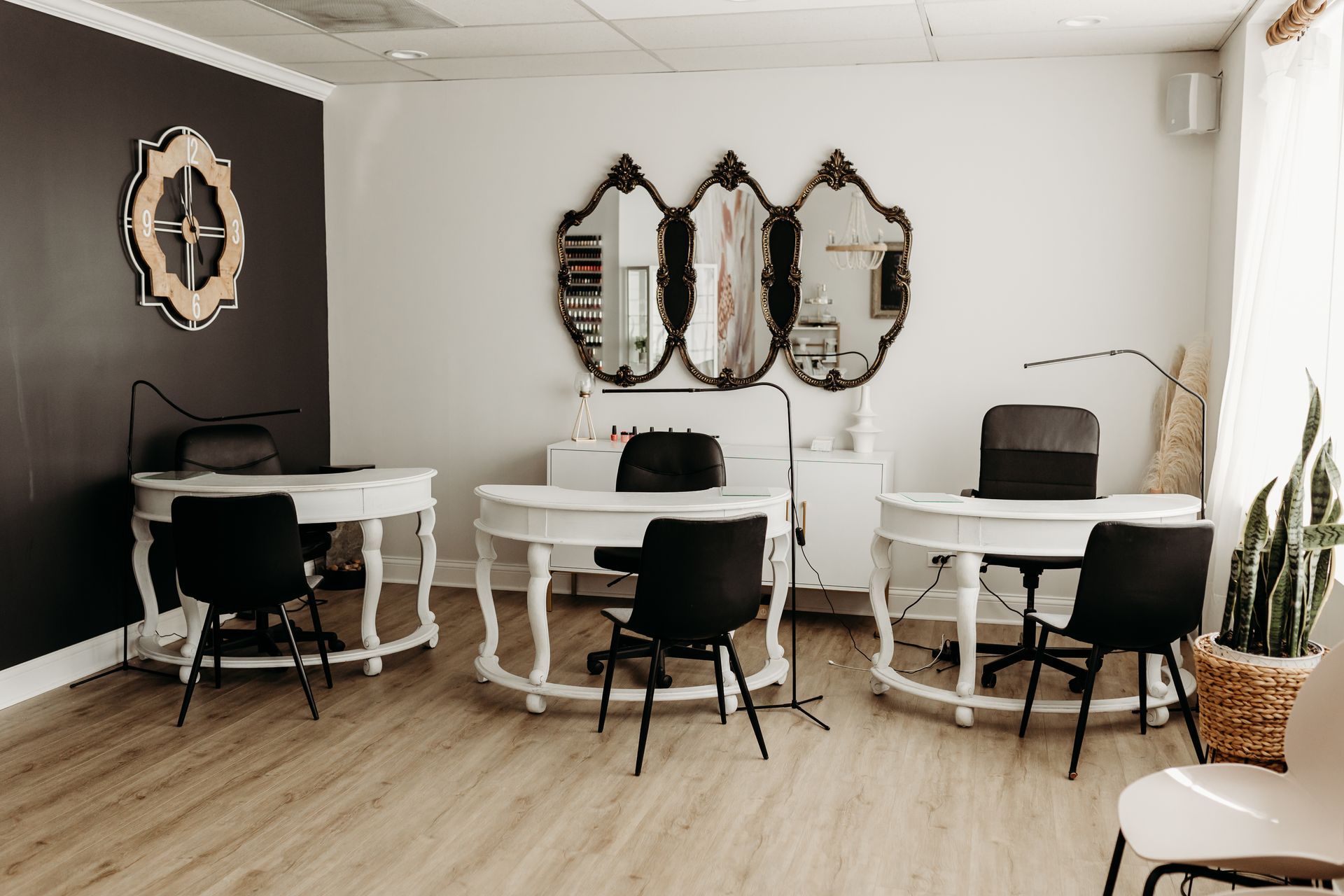 A room with three tables and chairs in it.