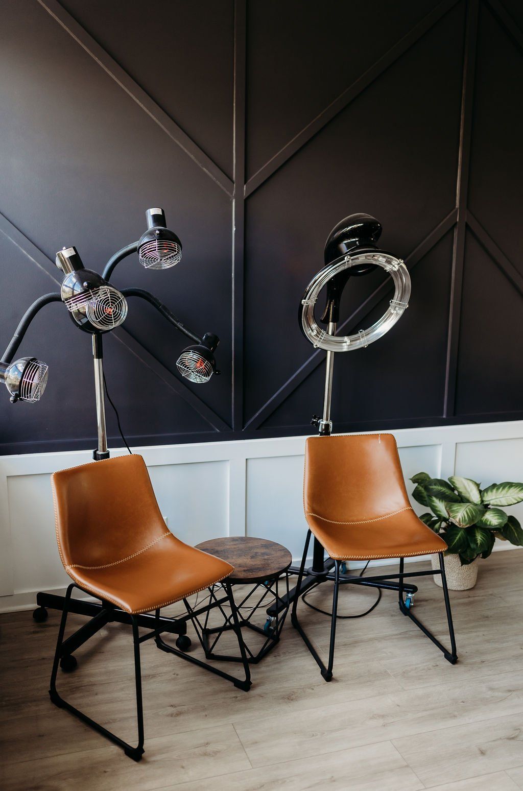 There are two chairs and a table in the room.