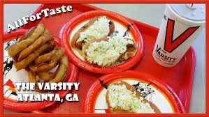 Red tray with food from The Varsity: fries, hot dogs with slaw, and a drink.