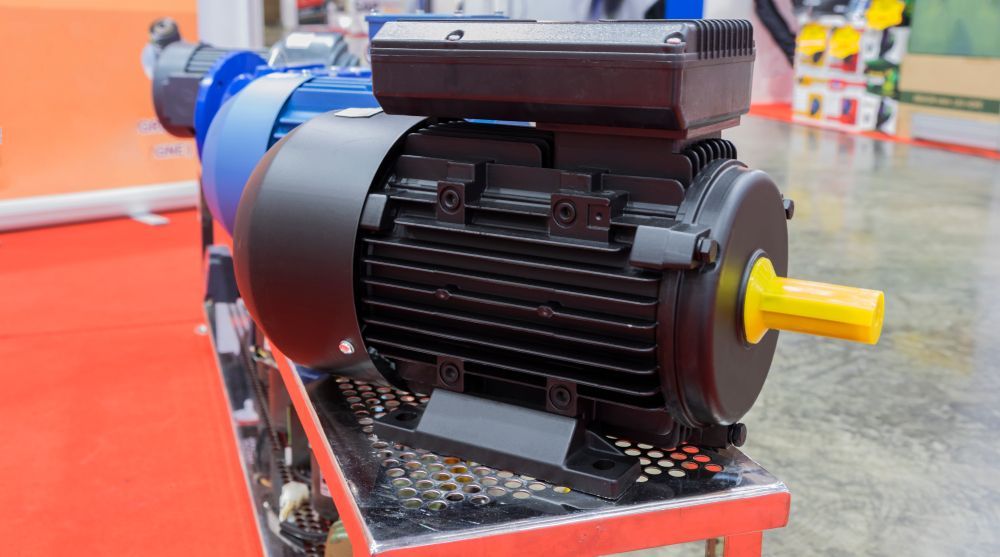 Electric Motor, Black and Blue, on a Metal Stand — Cairns Electrical Rewinds & Repairs In Townsville, QLD