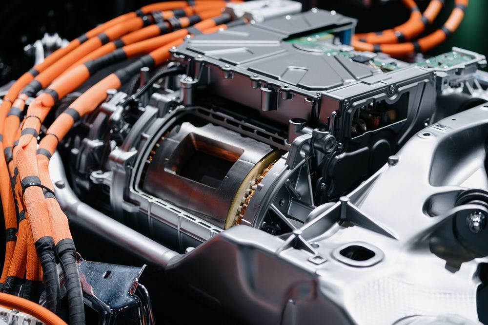Electric Vehicle Motor With Orange and Black Wiring — Cairns Electrical Rewinds & Repairs In Bungalow, QLD