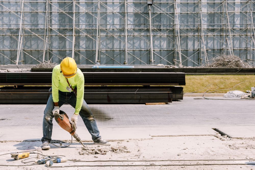 Construction Worker in Yellow Hard Hat — Cairns Electrical Rewinds & Repairs In Bungalow, QLD