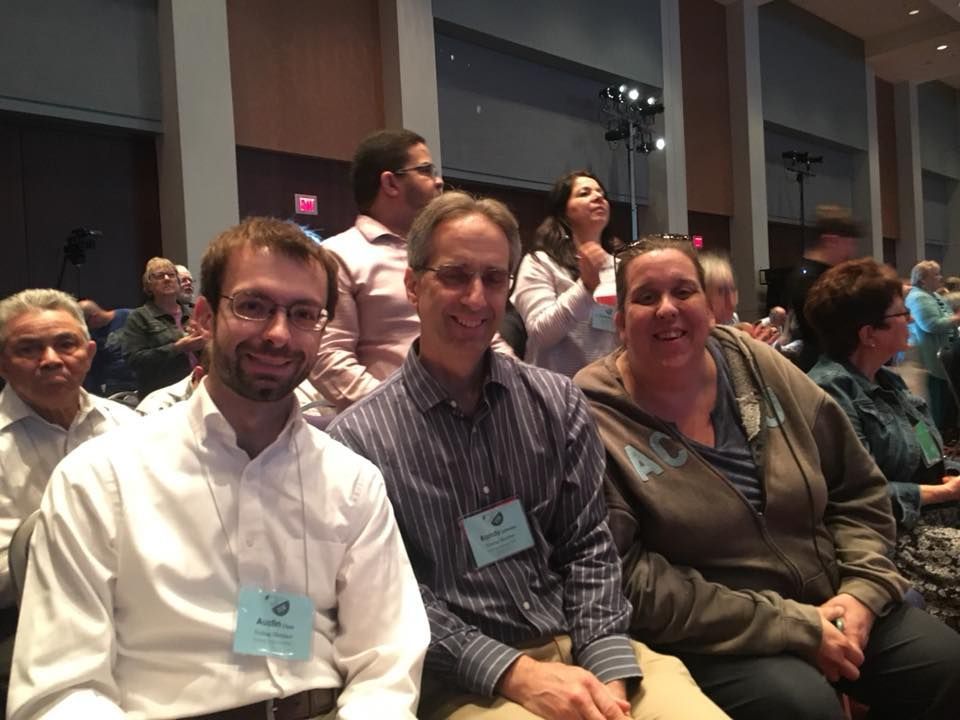 Three People Smiling at A Conference — Amherst, MA — Immanuel Lutheran Church