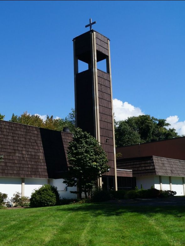 Church with Tall, Dark Brown Bell Tower Topped with A Cross — Amherst, MA — Immanuel Lutheran Church