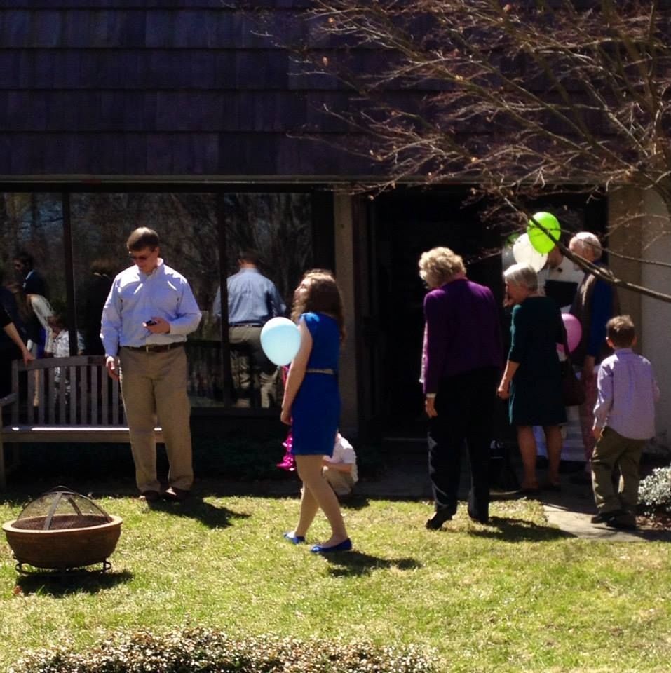 People Outdoors Near a Building with Large Windows — Amherst, MA — Immanuel Lutheran Church