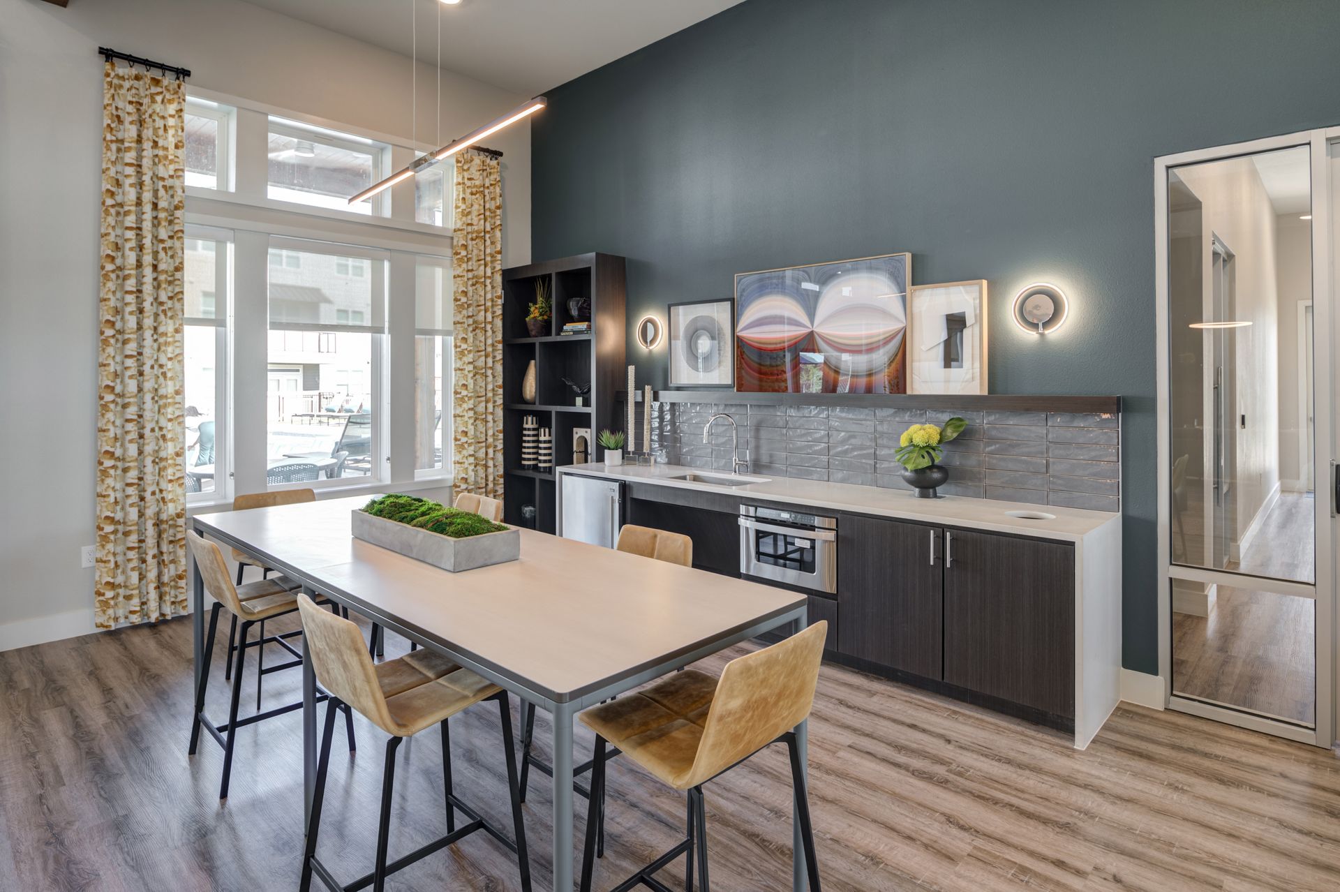 A kitchen with a long table and chairs in it at The Jameson.