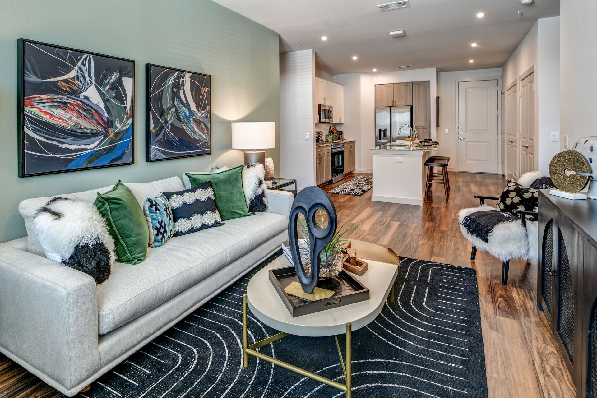 A living room with a couch , coffee table and chairs at The Jameson.