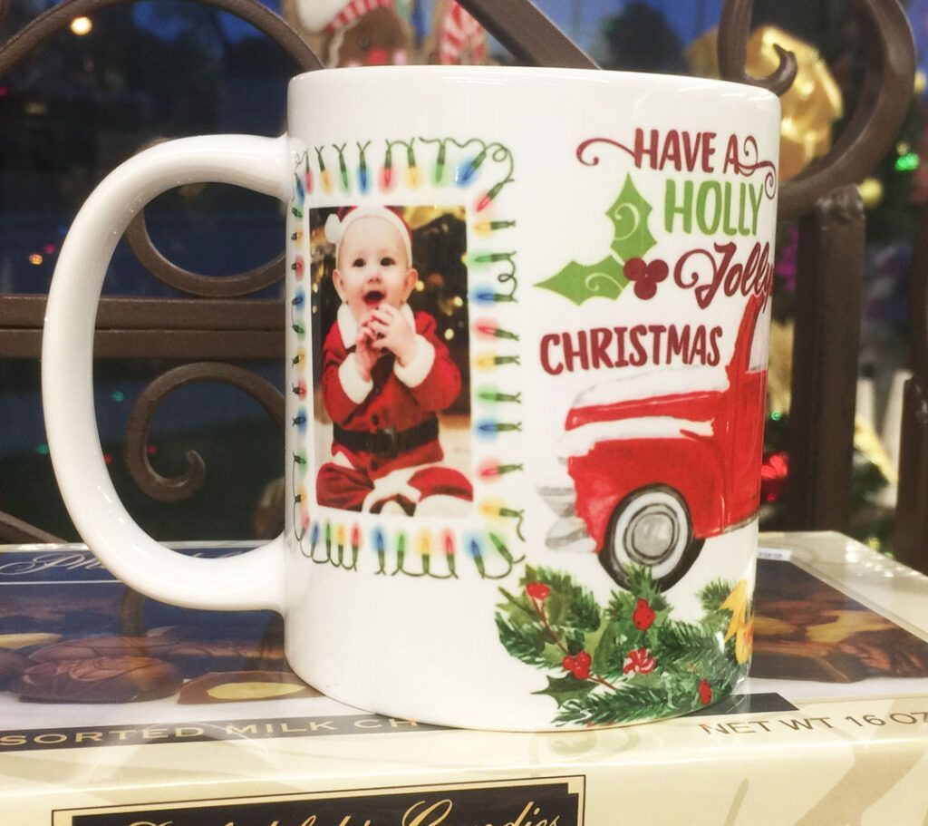 Christmas mug with red truck, holly, and “Have a Holly Jolly Christmas” text, holding a child’s photo