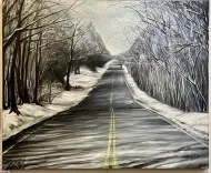 Snow-dusted road stretching through bare winter trees under a gray sky