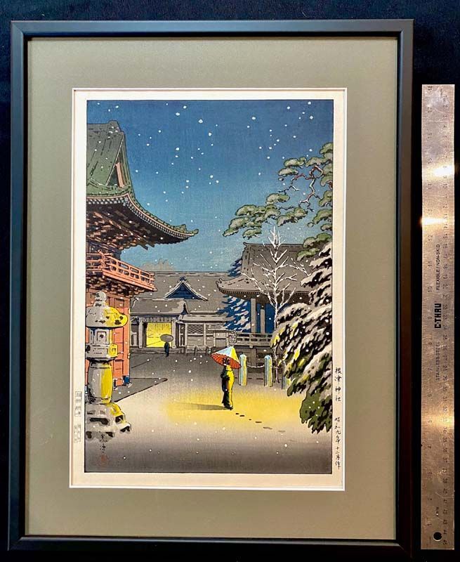 Framed print of a snowy Japanese temple courtyard under a blue starry sky