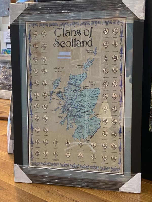 Framed Clans of Scotland map print with clan crests on a beige background
