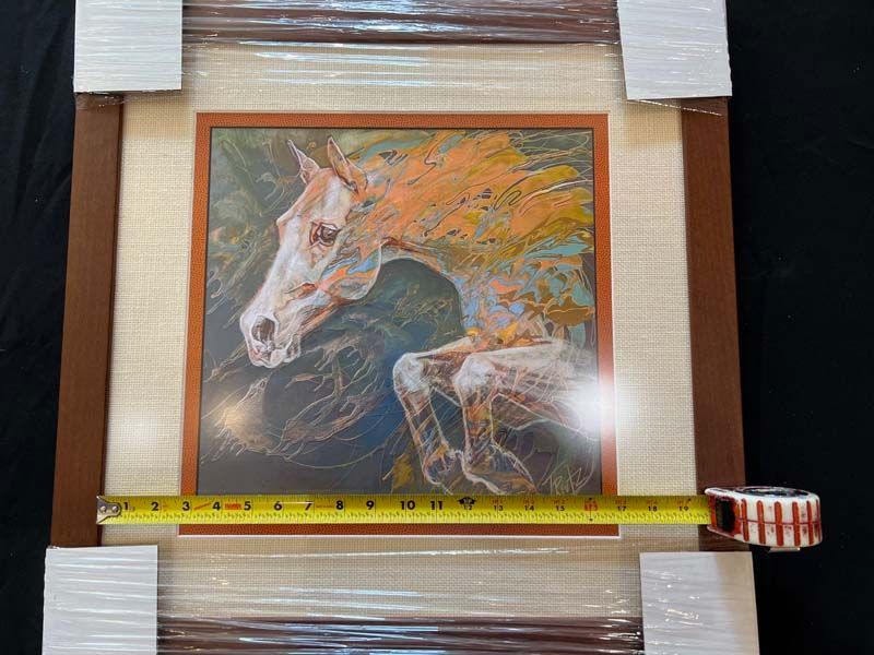 Framed painting of a white horse with an orange mane, measured with a tape across the bottom.