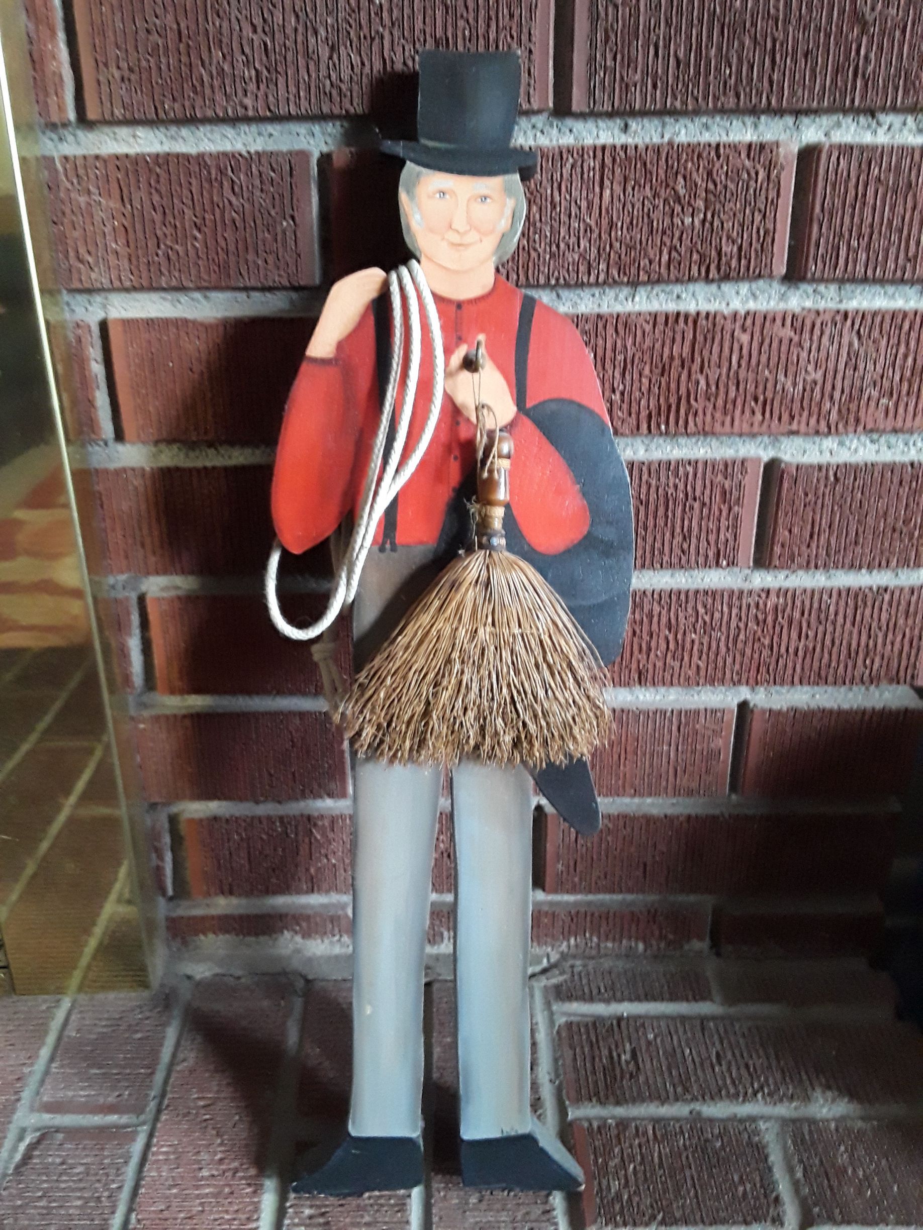 A decoration of a chimney sweep who does wood-burning stove installation in Greeley, CO
