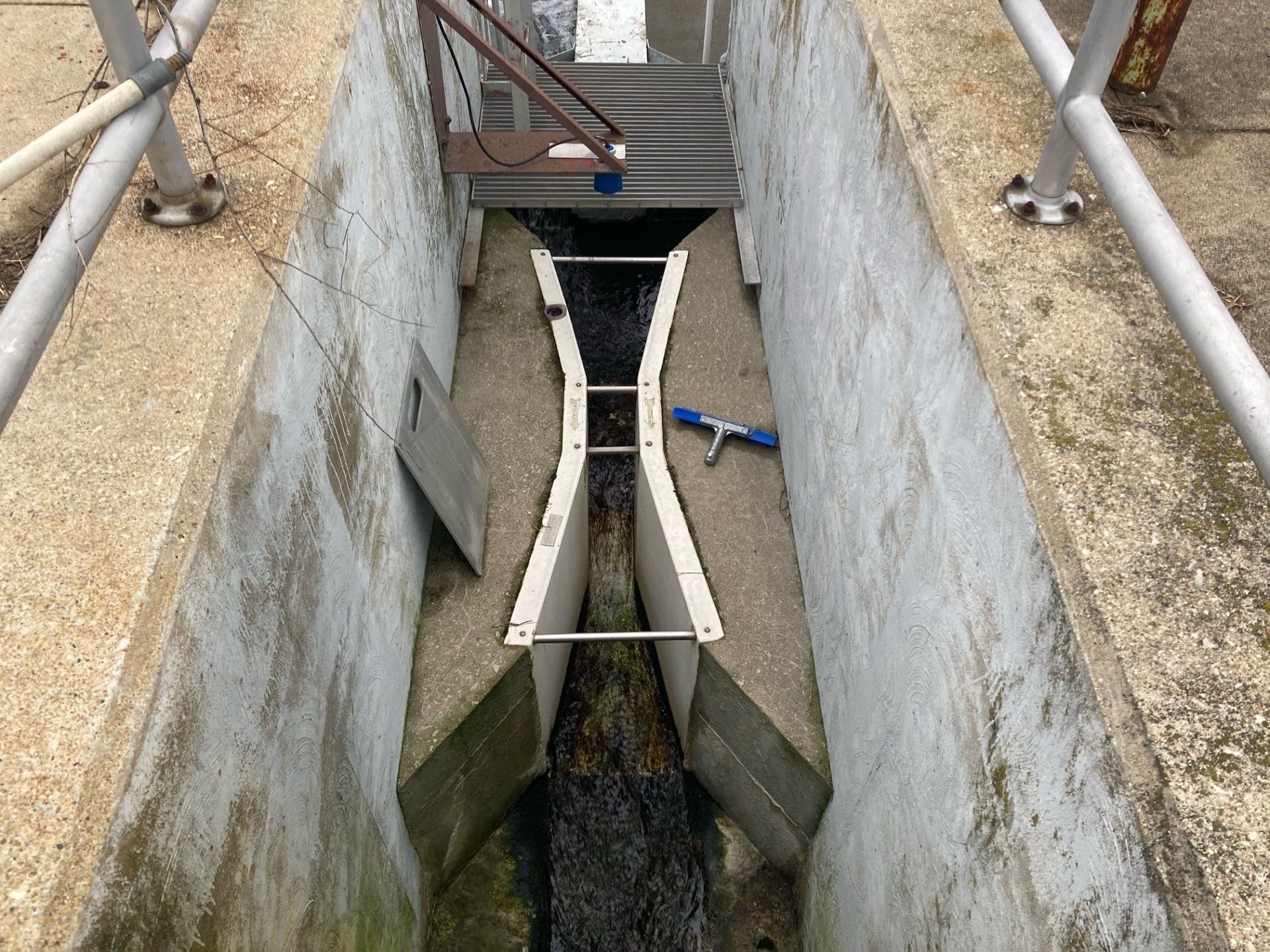 A concrete tunnel with a staircase leading up to it