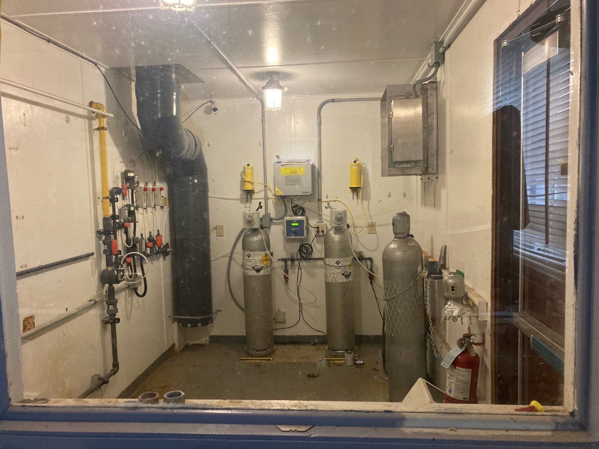 A room with a lot of gas cylinders in it