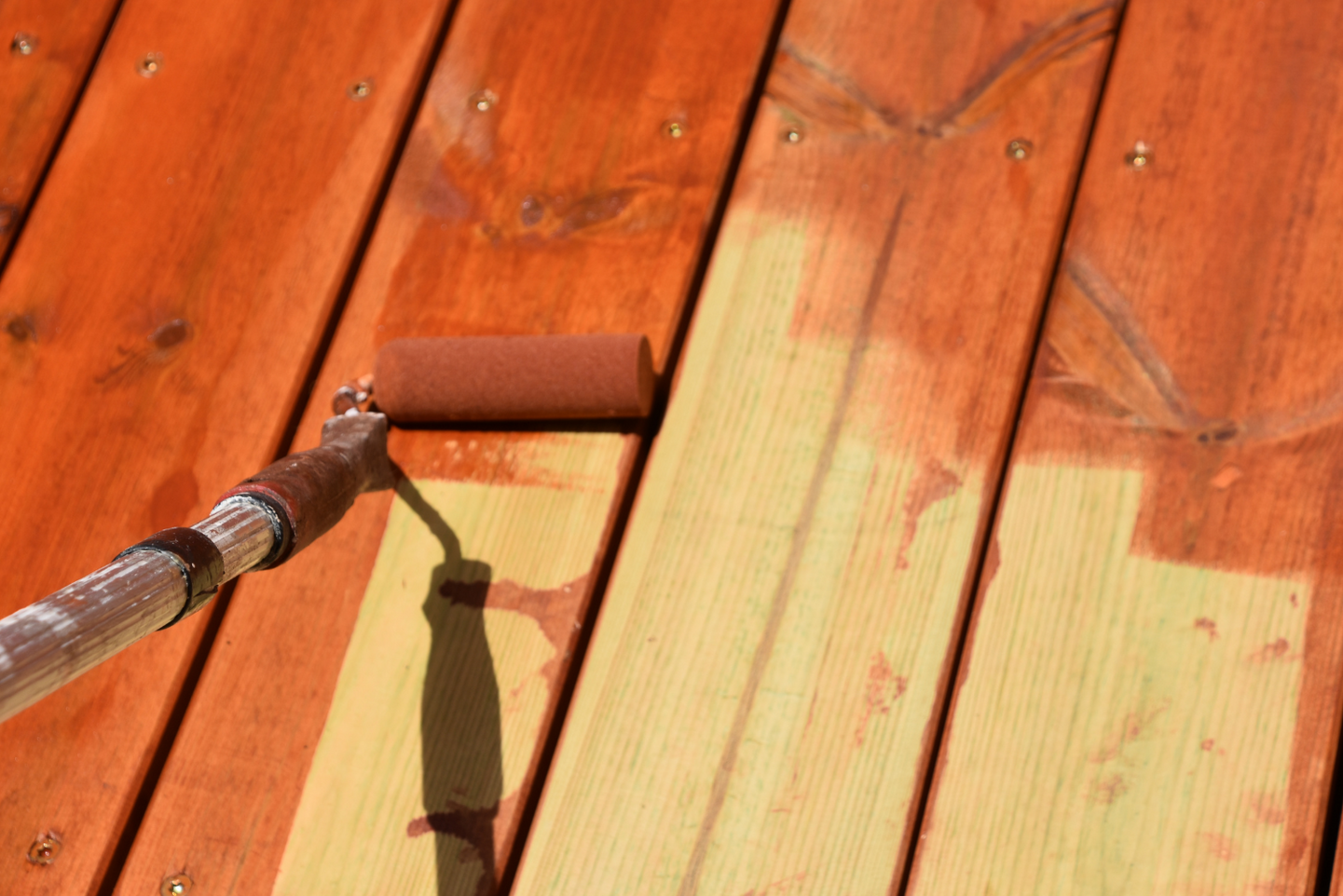 Staining a deck red