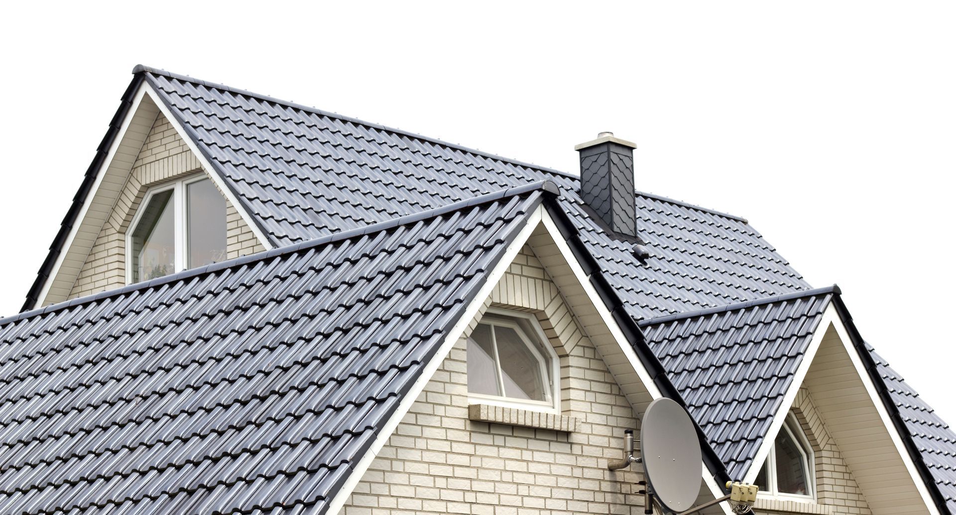 two men are working on the roof of a house