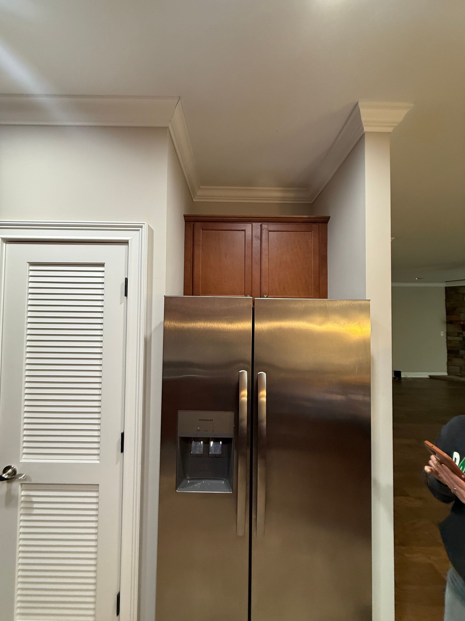 Kitchen with wood cabinets, stainless steel appliances, and granite countertops.