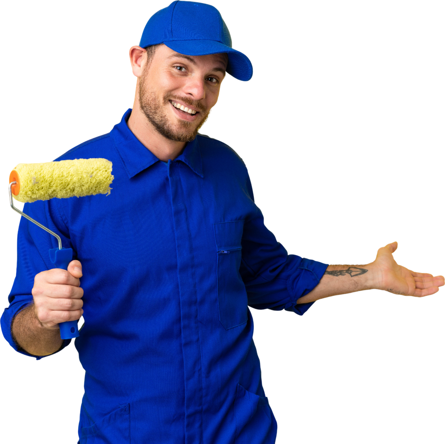 A man in a blue shirt is holding a paint roller