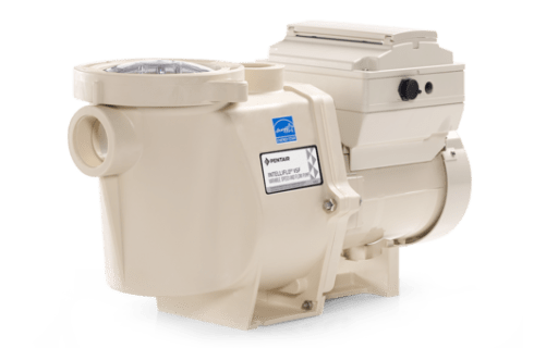 A white swimming pool pump is sitting on a white surface.