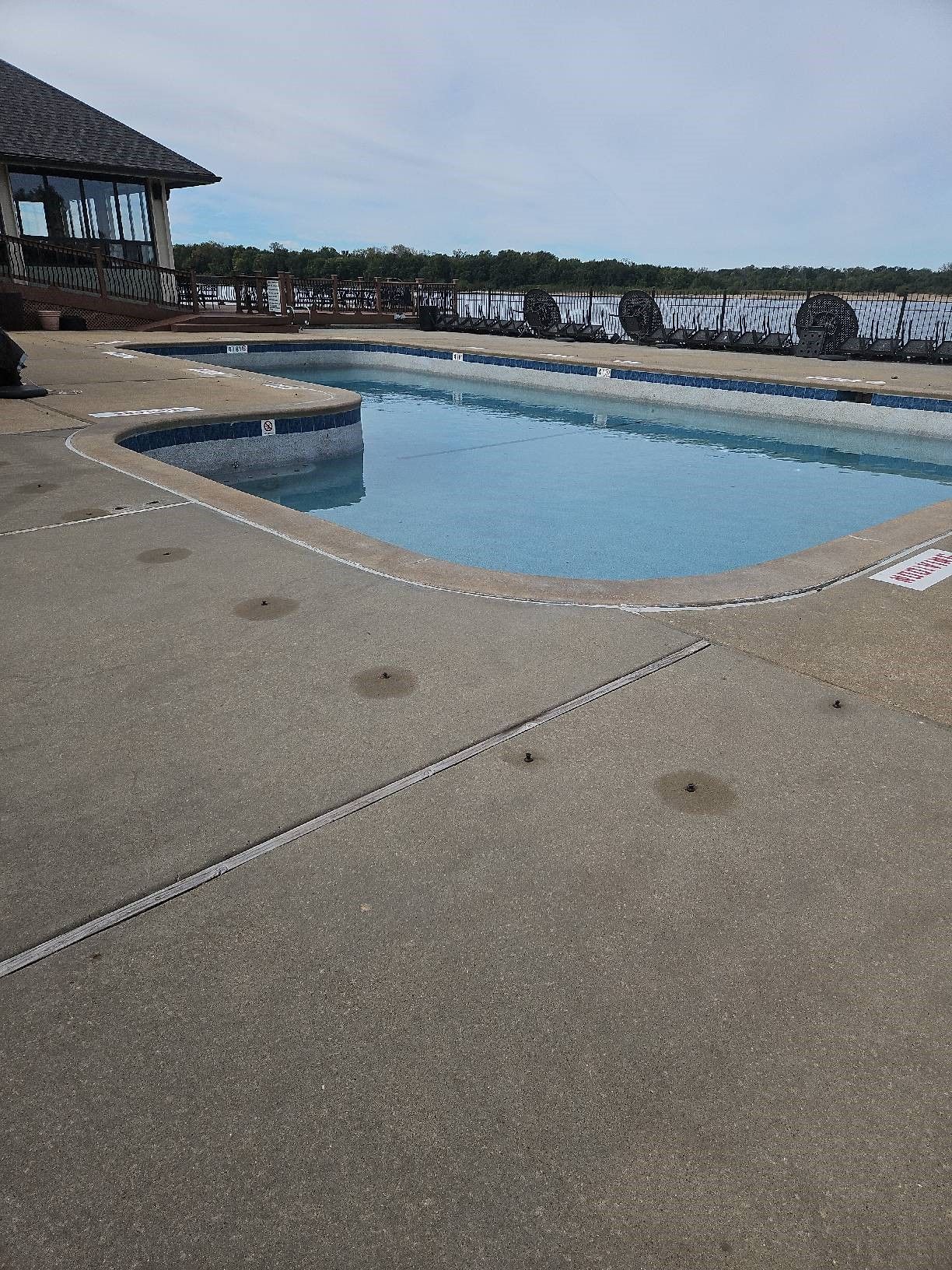  A concrete pool overlooking a lake 