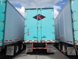 A blue trailer with the letter k on it