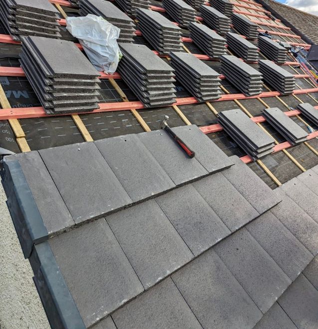 A close up of a roof with a skylight on it.