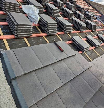 A close up of a roof with a skylight on it.