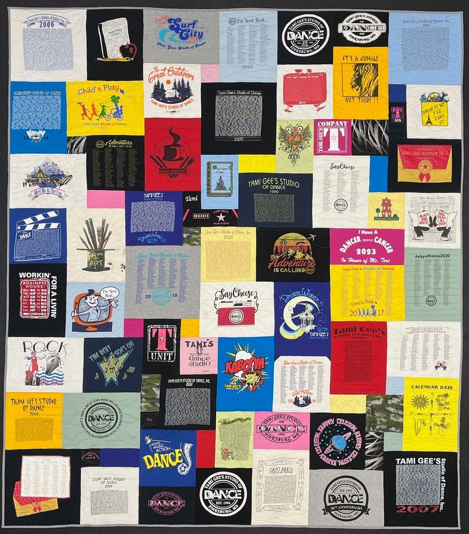 A quilt made out of old t-shirts including one that says where