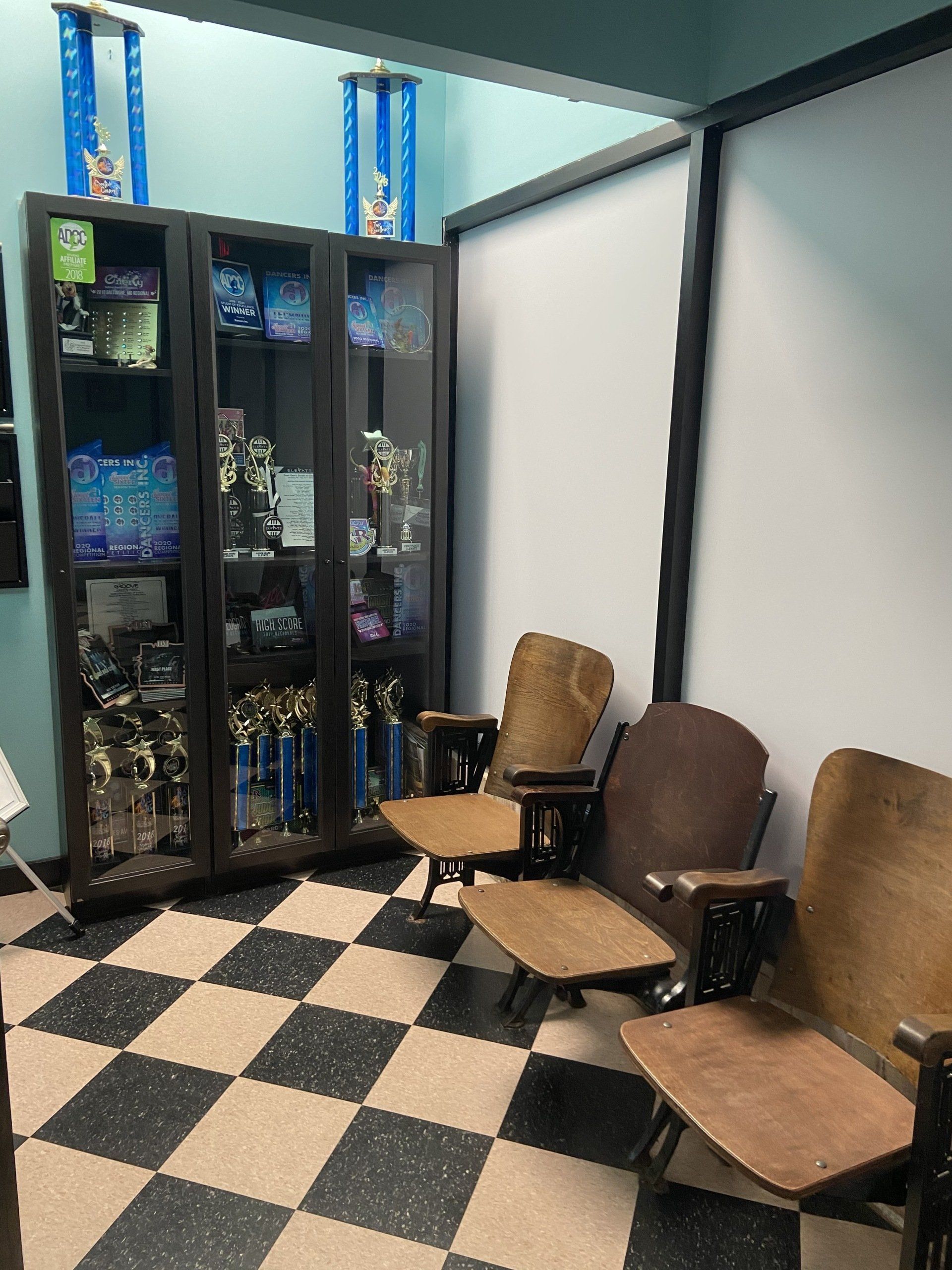 A room with chairs and a checkered floor