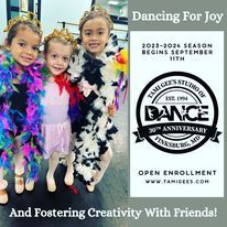 A group of young girls are standing next to each other in a dance studio.