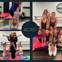 A group of young girls are doing acrobatic exercises in a dance studio.