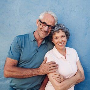 Smiling mature couple standing together - senior insurance in Marion, IA
